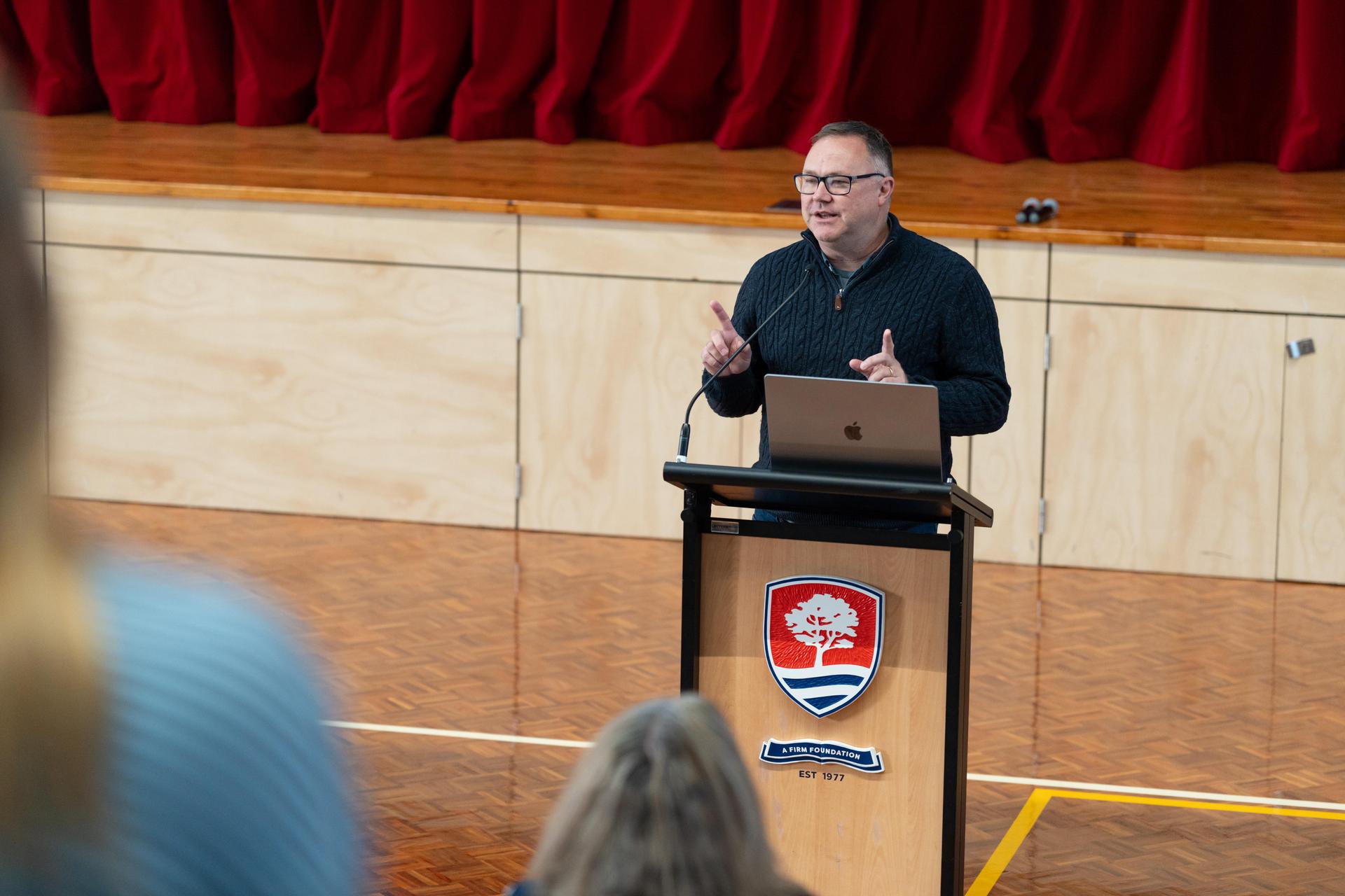 David Collins speaks to staff.